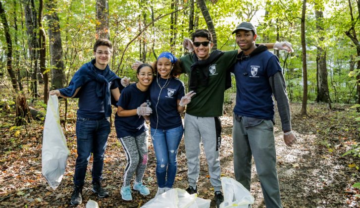 Group picture of students cleaning up litter